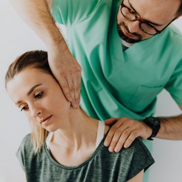 nurse working on patients neck